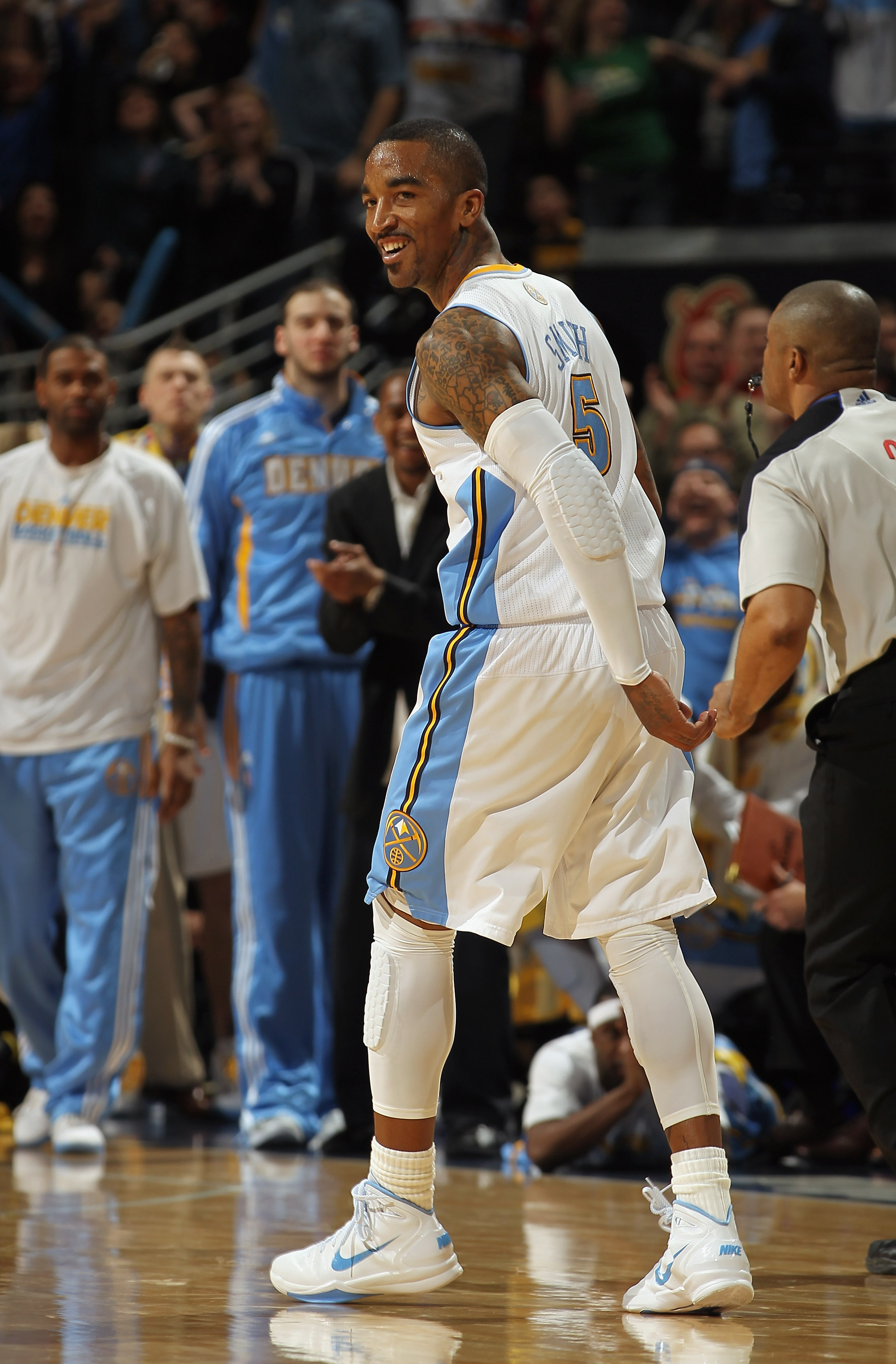 DENVER, CO - MARCH 23:  J.R. Smith #5 of the Denver Nuggets celebrates after scoring against the San Antonio Spurs to give the Nuggets their first lead of the game 99-98 in the fourth quarter at the Pepsi Center on March 23, 2011 in Denver, Colorado. The