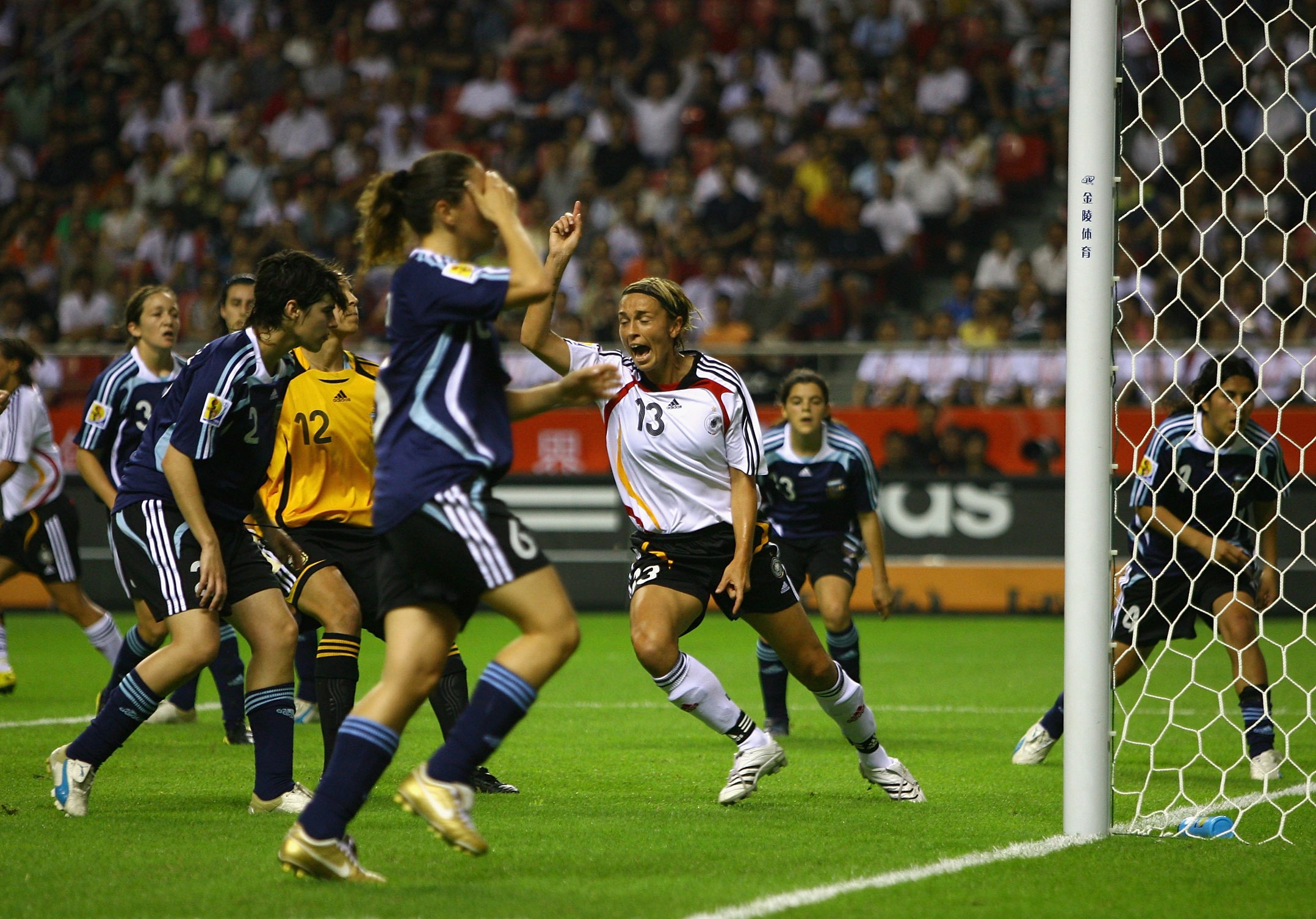 SHANGHAI, CHINA - SEPTEMBER 10:  Sandra Minnert of Germany celebrates after Vanina Correa of Argentina scored an own goal during the FIFA Women's World Cup 2007 Group A match between Germany and Argentina at the Shanghai Hongkou Football Stadium on Septem