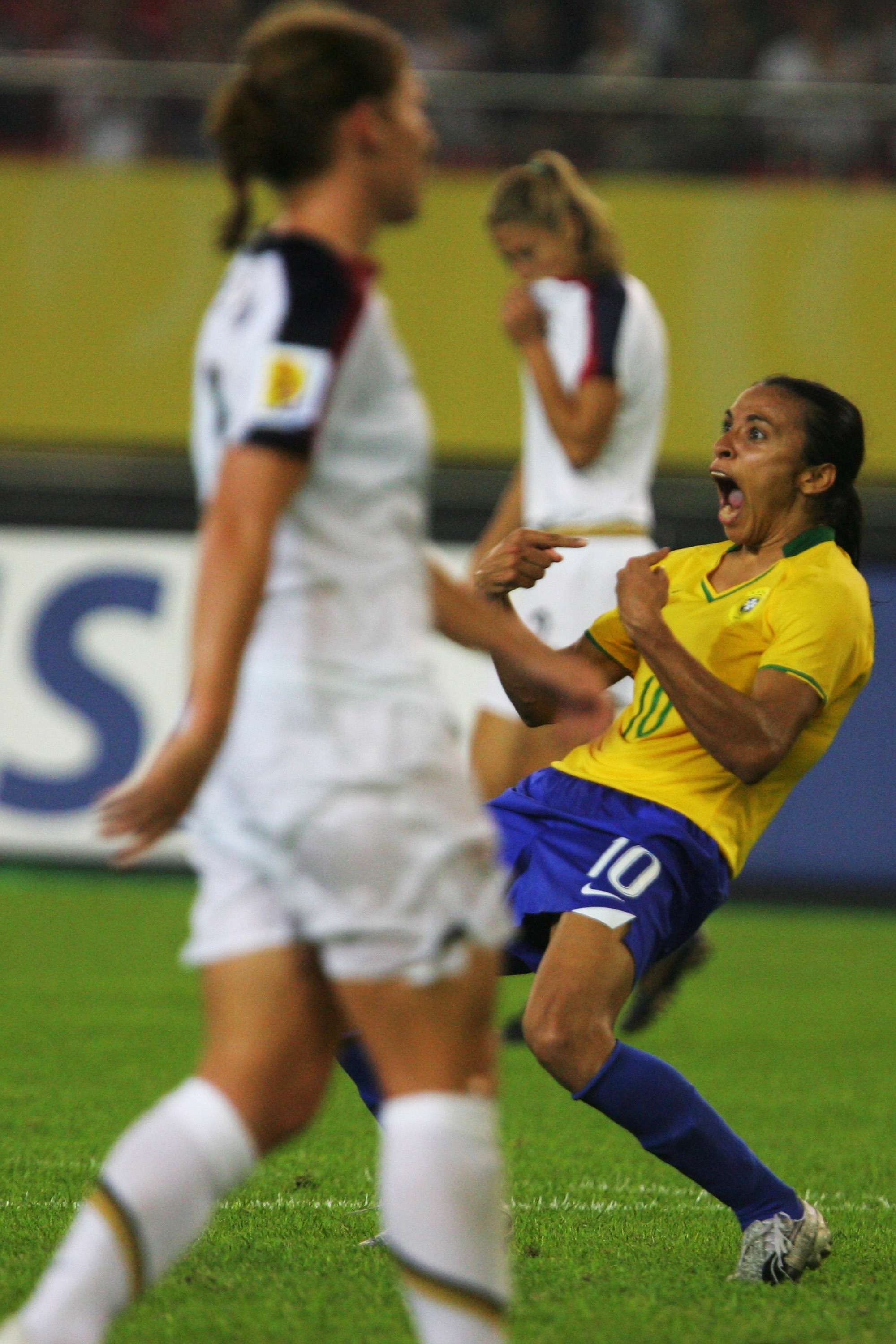 HANGZHOU, ZHEJIANG - SEPTEMBER 27:  Marta(R 10#)  of Brazil celebrates the goal  during the Womens World Cup 2007 Semi Final match between USA and Brazil at Hangzhou Dragon Stadium on September 27, 2007 in Hangzhou, Zhejiang province of China.  (Photo by