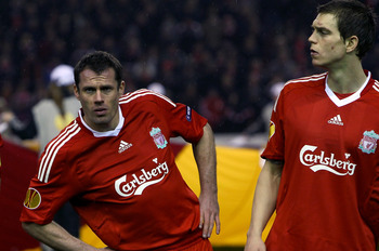 LIVERPOOL, ENGLAND - FEBRUARY 18:  Steven Gerrard,Jamie Carragher and Daniel Agger in the pre match team line up during the UEFA Europa League Round 32 first leg match between Liverpool and Unirea Urzicen at Anfield on February 18, 2010 in Liverpool, Engl