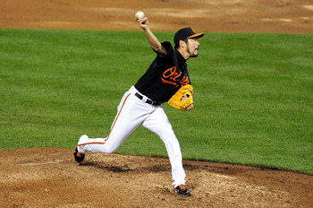 BALTIMORE, MD - MAY 06:  Koji Uehara #19 of the Baltimore Orioles pitches against the Tampa Bay Rays at Oriole Park at Camden Yards on May 6, 2011 in Baltimore, Maryland.  (Photo by Greg Fiume/Getty Images)