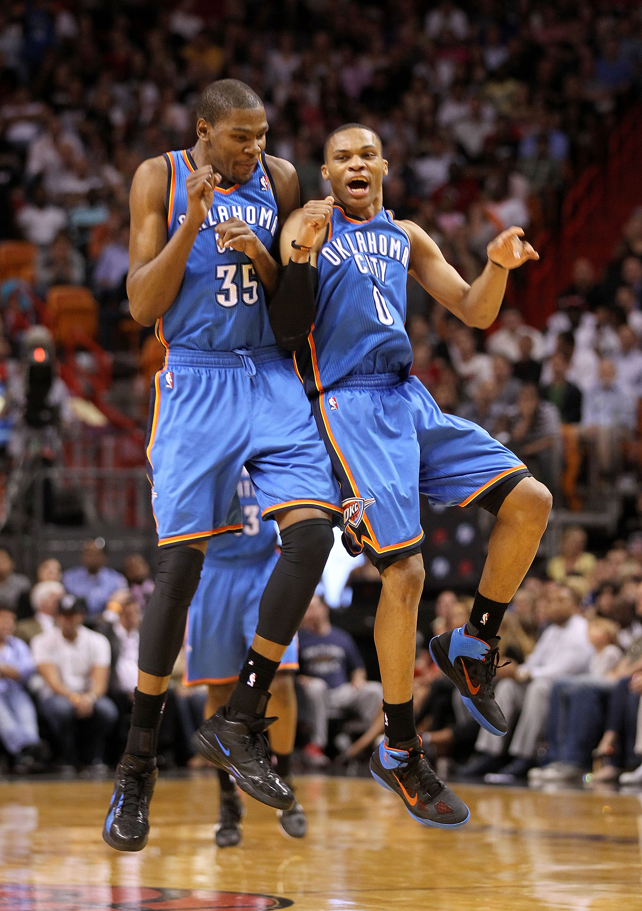 MIAMI, FL - MARCH 16:  Kevin Durant #35 and Russell Westbrook #0 of the Oklahoma City Thunder celebrate after a 3 pointer during a game against the Miami Heat at American Airlines Arena on March 16, 2011 in Miami, Florida. NOTE TO USER: User expressly ack