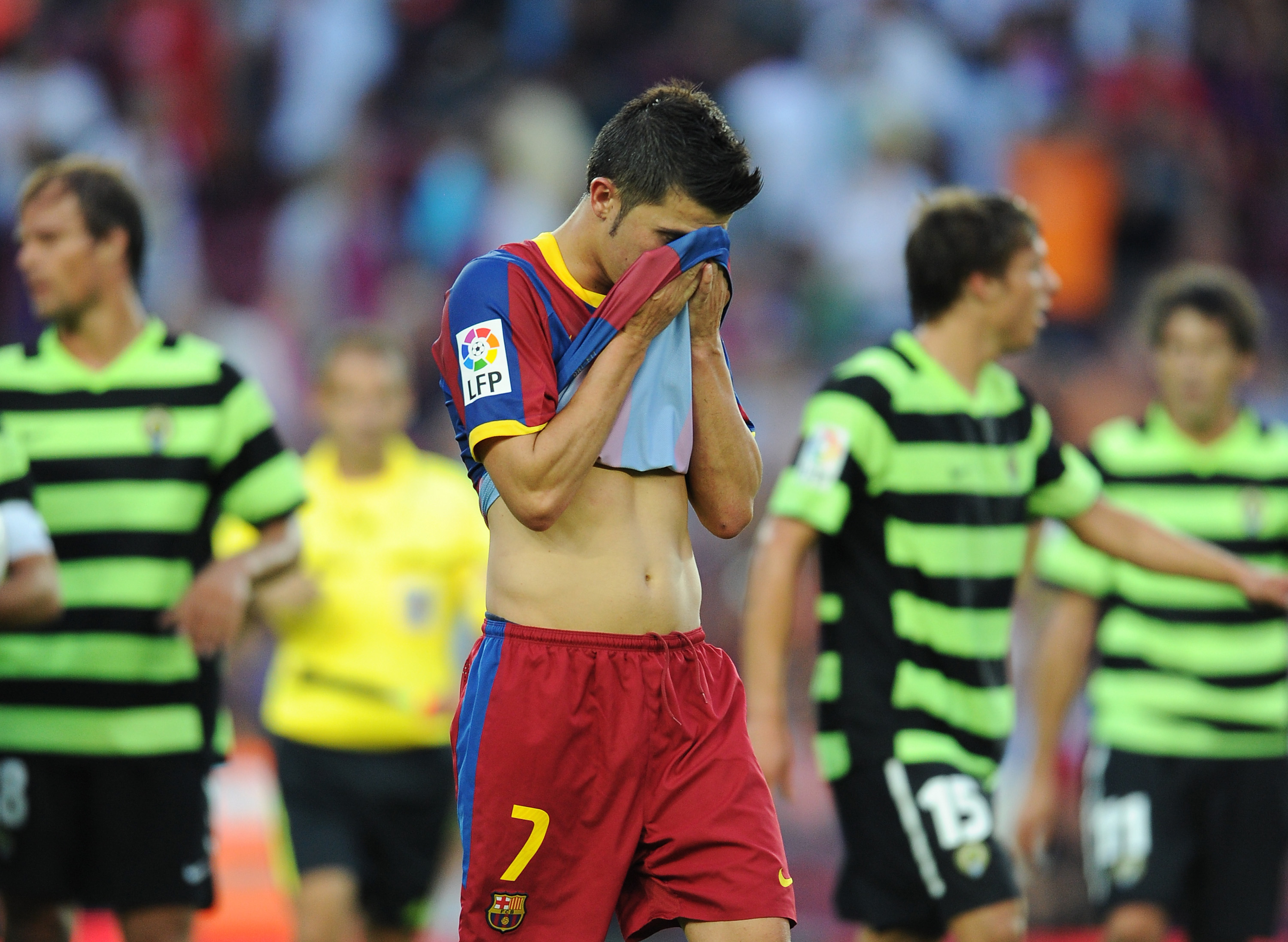 BARCELONA, SPAIN - SEPTEMBER 11:  David Villa of Barcelona trudges off the pitch at the end of the La Liga match between Barcelona and Hercules at the Camp Nou stadium on September 11, 2010 in Barcelona, Spain. Barcelona lost the match 2-0.  (Photo by Jas