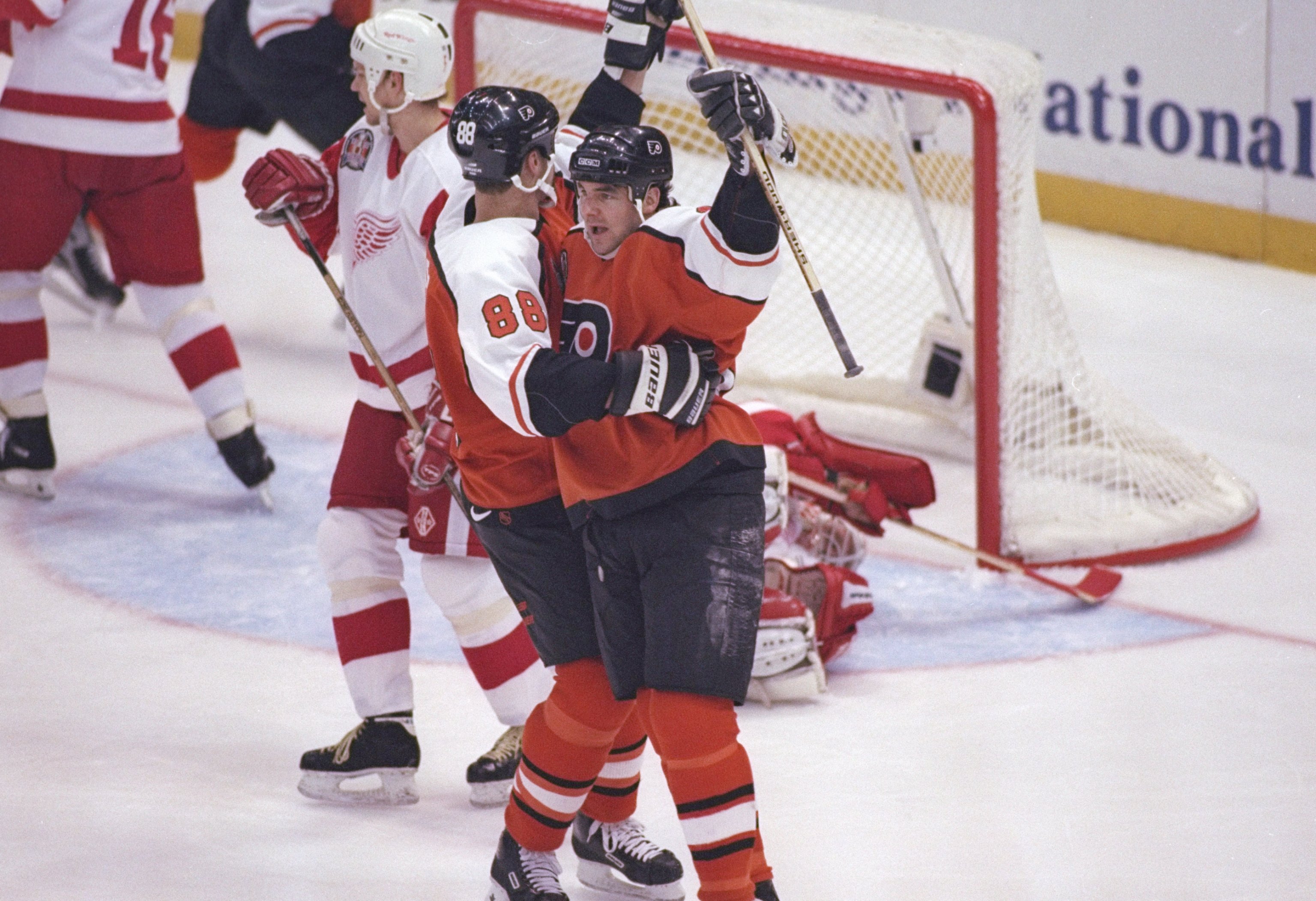 5 Jun 1997:  Center Eric Lindros (left) and leftwinger John Leclair of the Philadelphia Flyers celebrate during a playoff game against the Detroit Red Wings at Joe Louis Arena in Detroit, Michigan.  The Red Wings won the game, 6-1. Mandatory Credit: Al Be