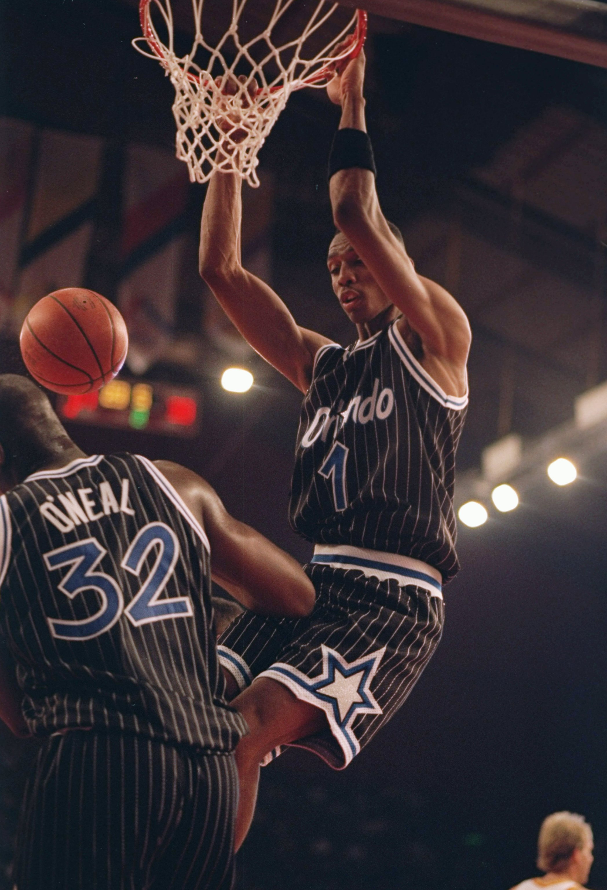 Oct 1993:  Center Shaquille O''Neal of the Orlando Magic (left) ducks the ball after teammate guard Anfernee Hardaway slam dunks it during a game against the Atlanta Hawks at Wembley Stadium in London, England. Mandatory Credit: Mike Cooper  /Allsport