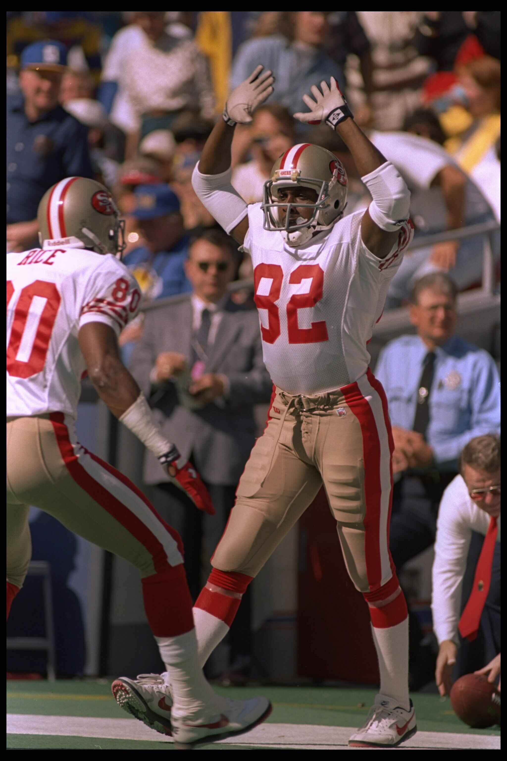 22 Oct 1995:  Receiver John Taylor #82 of the San Fransisco 49ers celebrates with teammate Jerry Rice during the 49ers 44-10 win over the St. Louis Rams at Busch Memorial Stadium in St. Louis, Missouri.  Mandatory Credit:  Jaime Squire/Allsport