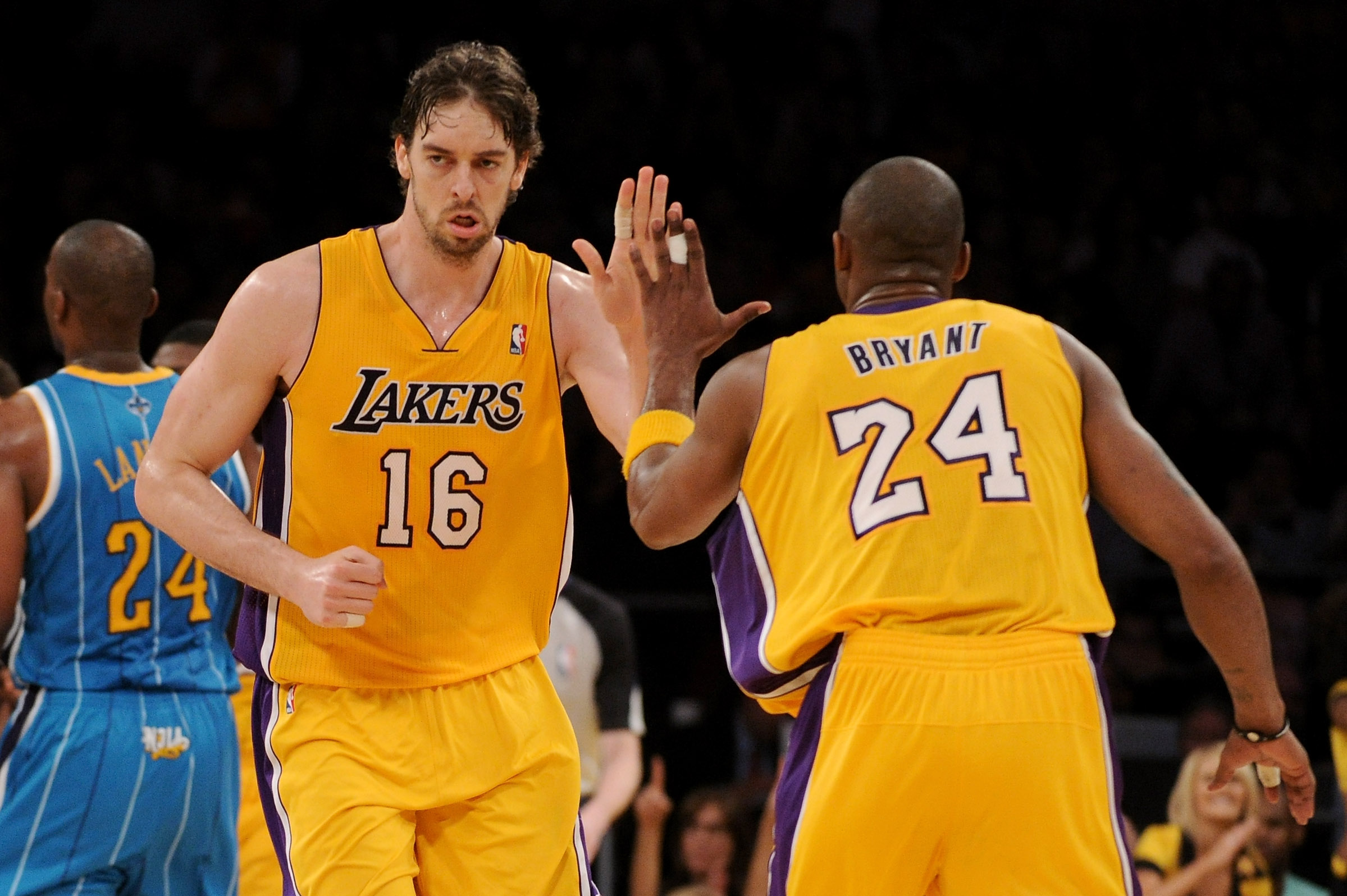 LOS ANGELES, CA - APRIL 26:  Pau Gasol #16 reacts with teammate Kobe Bryant #24 of the Los Angeles Lakers in the third quarter while taking on the New Orleans Hornets in Game Five of the Western Conference Quarterfinals in the 2011 NBA Playoffs on April 2