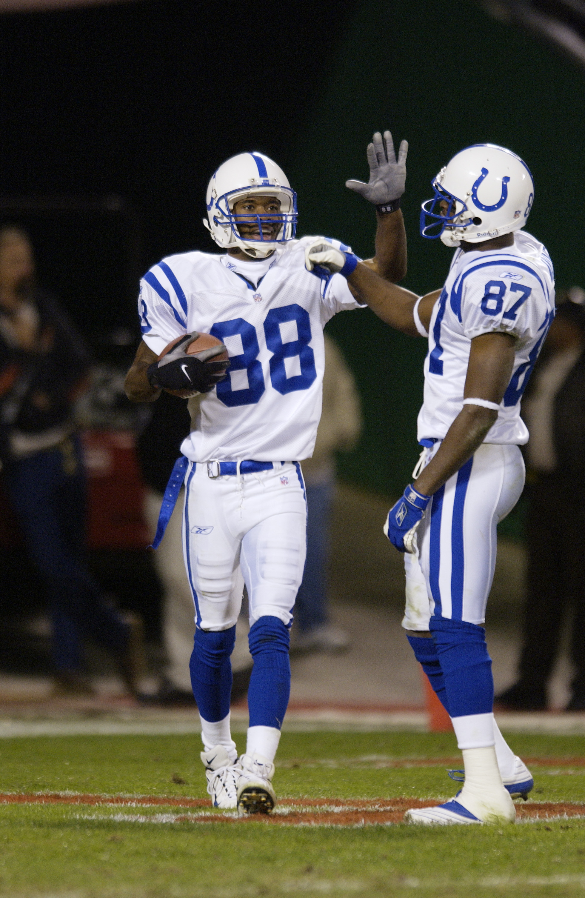 25 Oct 2001 : Marvin Harrison #88 of the Indianapolis Colts is congratulated by Reggie Wayne #87 after scoring a touchdown against the Kansas City Chiefs during the game at Arrowhead Stadium in Kansas City, Missouri. The Colts won 35-28. DIGITAL IMAGE. Ma