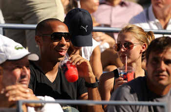 NEW YORK - SEPTEMBER 08:  French Soccer Player Thierry Henry (L) and Andrea Rajacic (R) attend day ten of the 2010 U.S. Open at the USTA Billie Jean King National Tennis Center on September 8, 2010 in the Flushing neighborhood of the Queens borough of New