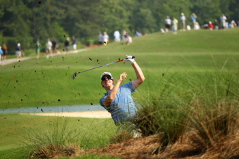 PONTE VEDRA BEACH, FL - MAY 06:  Hunter Mahan plays a shot from the rough on the 12th hole during the first round of THE PLAYERS Championship held at THE PLAYERS Stadium course at TPC Sawgrass on May 6, 2010 in Ponte Vedra Beach, Florida.  (Photo by Richa