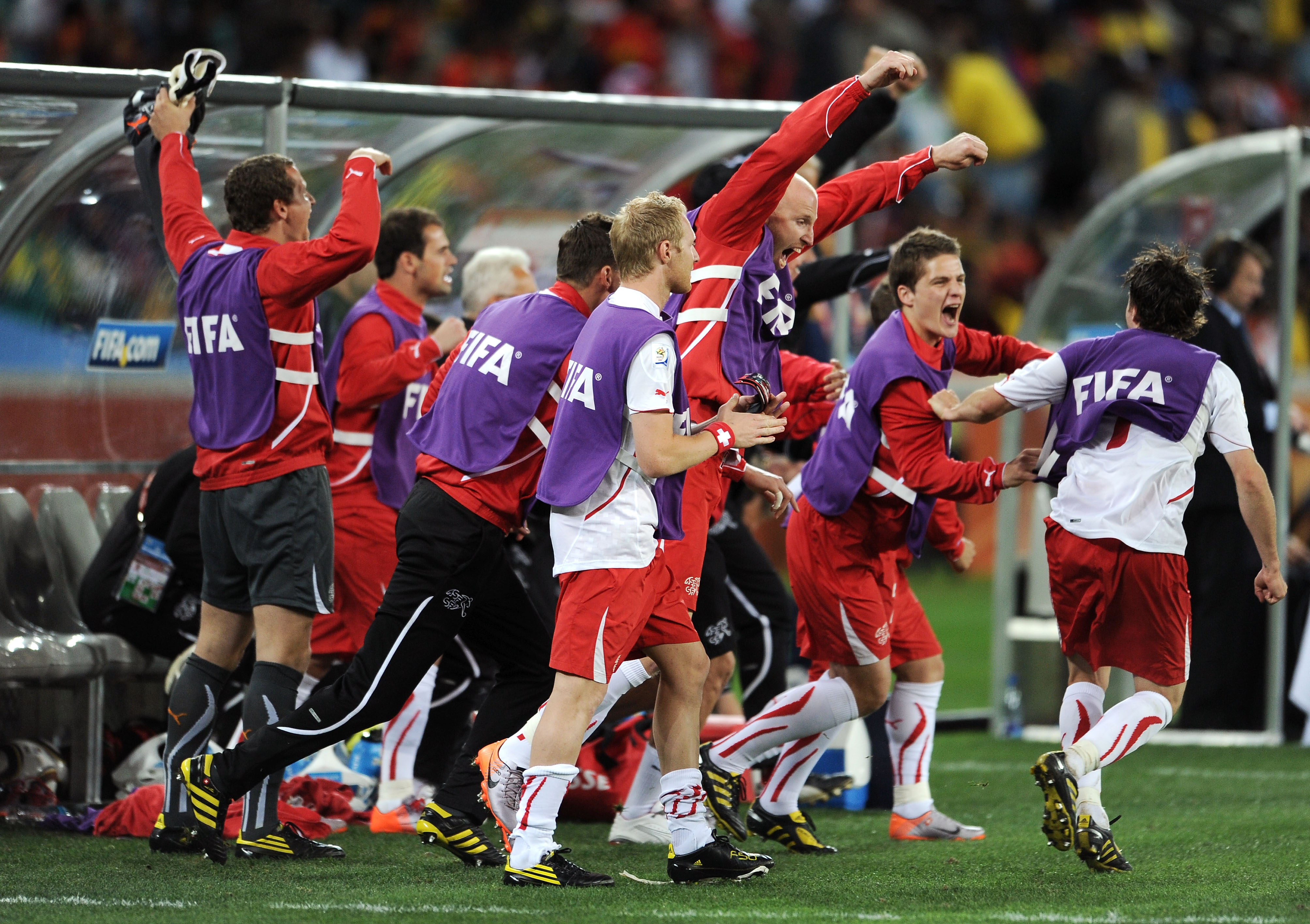 DURBAN, SOUTH AFRICA - JUNE 16:  The Switzerland team bench celebrate after victory in the 2010 FIFA World Cup South Africa Group H match between Spain and Switzerland at Durban Stadium on June 16, 2010 in Durban, South Africa.  (Photo by Jasper Juinen/Ge