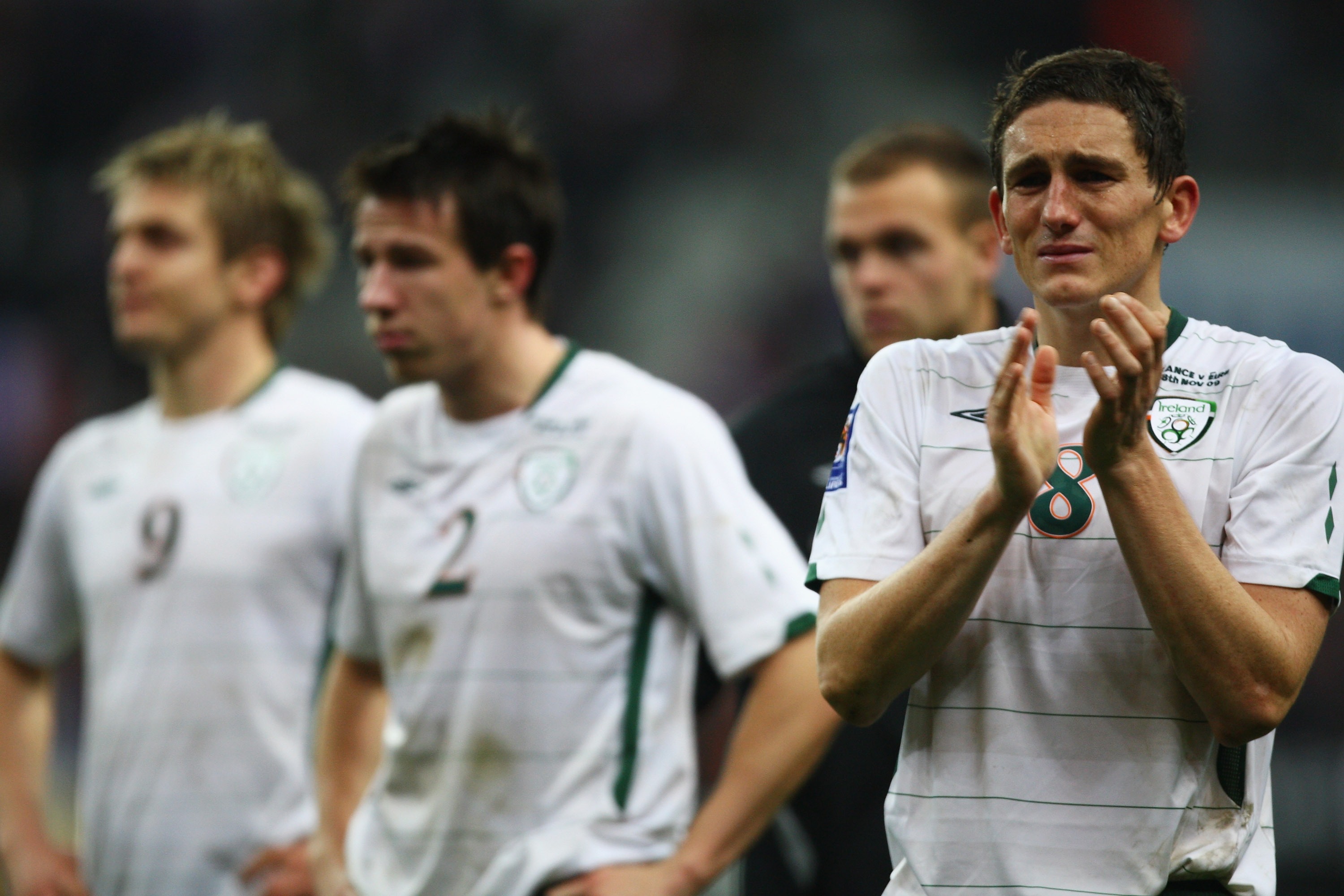 PARIS - FRANCE-NOVEMBER 18:  Keith Andrews (R) of Ireland applauds fans as Sean St. Ledger (C) and Kevin Doyle (L) look on after the FIFA 2010 World Cup Qualifying Play Off second leg match between France and Republic of Ireland at the Stade de France on