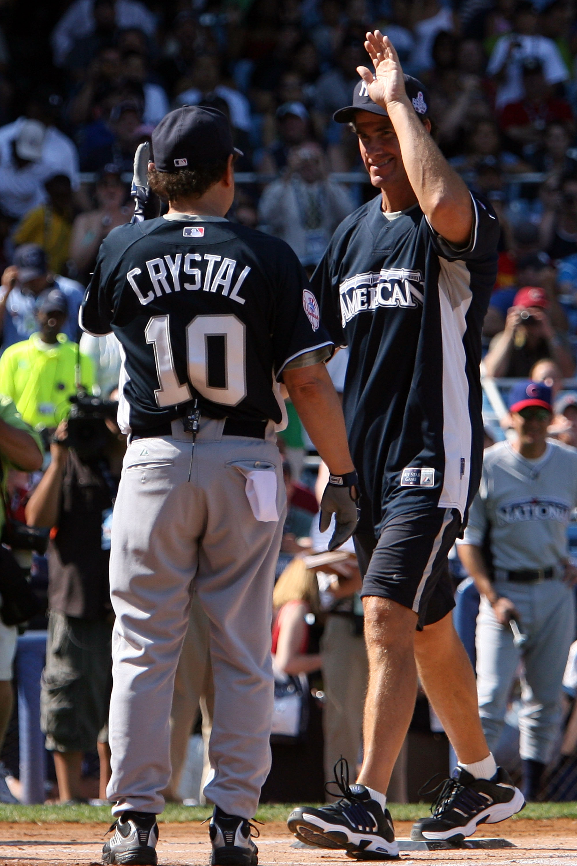 NEW YORK - JULY 13:  Actor Billy Crystal and Paul O'Neil play in the 2008 MLB All-Star Week Taco Bell All-Star Legends & Celebrity Softball Game at Yankee Stadium on July 13, 2008 in New York City.  (Photo by Bryan Bedder/Getty Images)