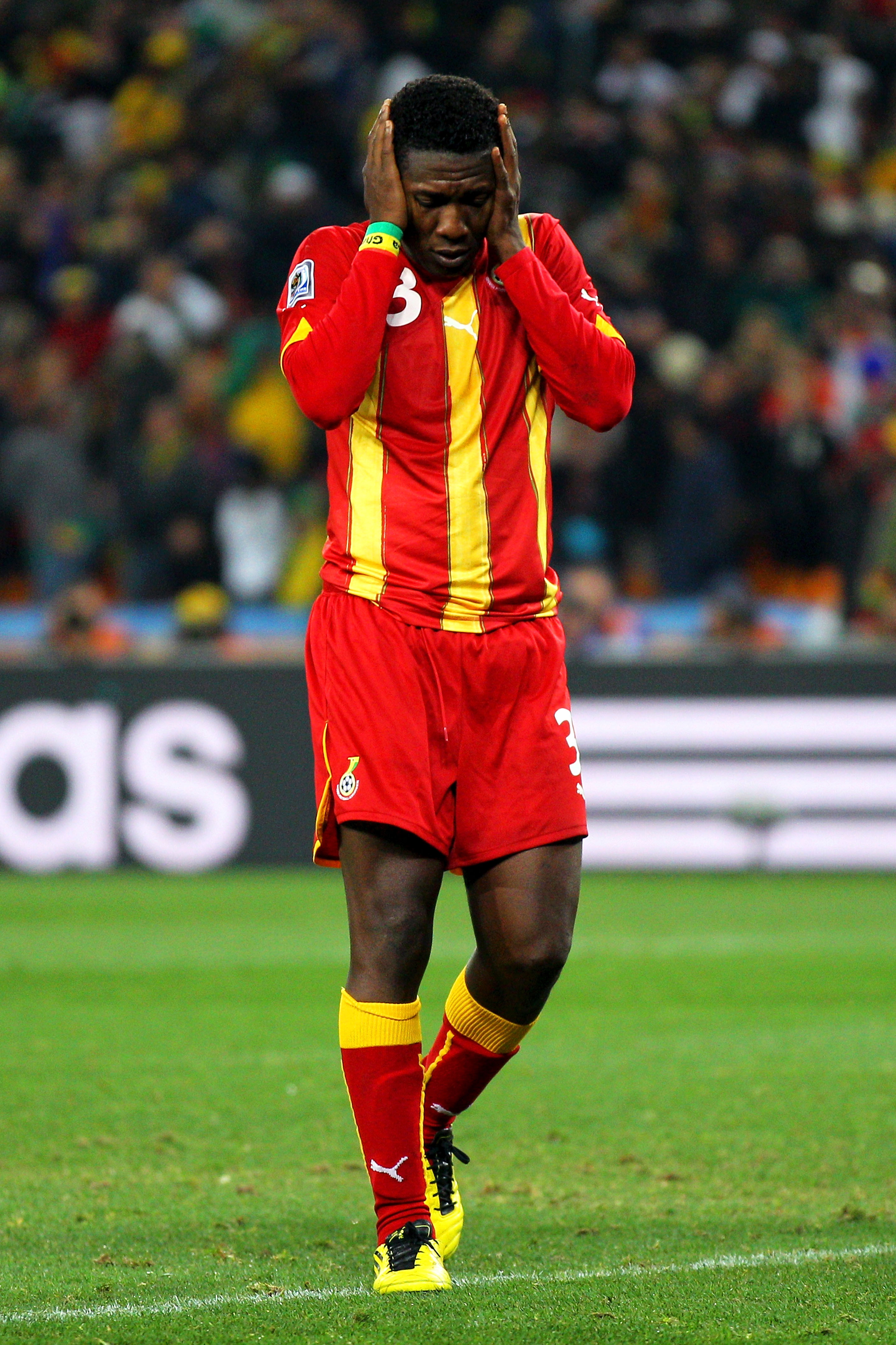 JOHANNESBURG, SOUTH AFRICA - JULY 02:  Asamoah Gyan of Ghana looks dejected after missing his penalty during the 2010 FIFA World Cup South Africa Quarter Final match between Uruguay and Ghana at the Soccer City stadium on July 2, 2010 in Johannesburg, Sou