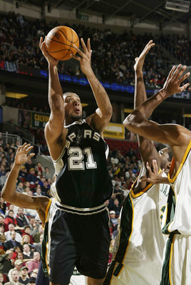 SEATTLE - DECEMBER 19:  Tim Duncan #21 of the San Antonio Spurs shoots against the Seattle SuperSonics on December 19 2003 at Key Arena in Seattle, Washington. DIGITAL IMAGE NOTE TO USER: User expressly acknowledges and agrees that, by downloading and/or