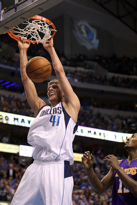 DALLAS, TX - MAY 08:  Forward Dirk Nowitzki #41 of the Dallas Mavericks gets the slam dunk against Ron Artest #15 of the Los Angeles Lakers in Game Four of the Western Conference Semifinals during the 2011 NBA Playoffs on May 8, 2011 at American Airlines