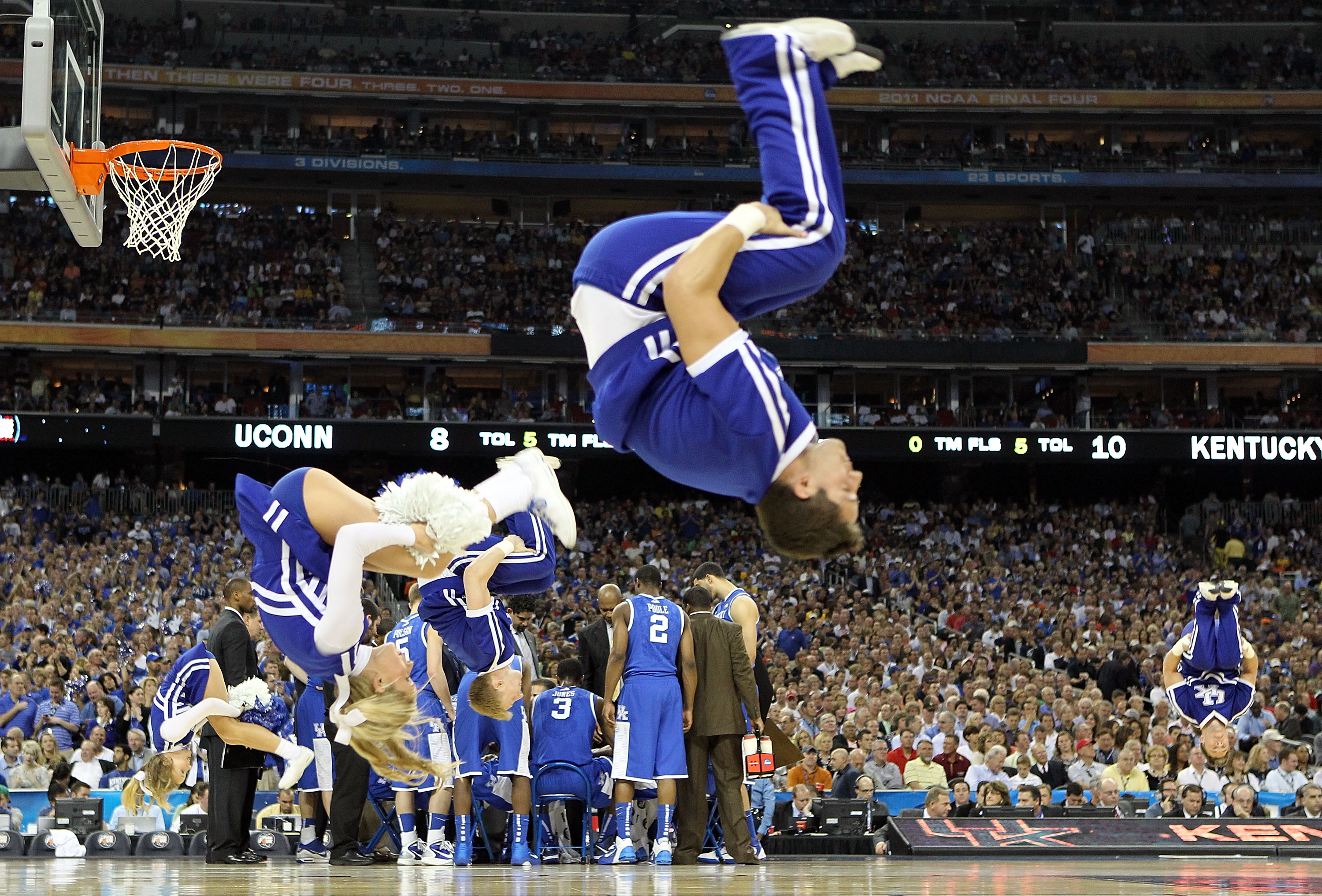 HOUSTON, TX - APRIL 02:  Cheerleaders from the Kentucky Wildcats performs during the National Semifinal game of the 2011 NCAA Division I Men's Basketball Championship at Reliant Stadium on April 2, 2011 in Houston, Texas.  (Photo by Streeter Lecka/Getty I