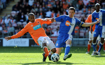 BLACKPOOL, ENGLAND - APRIL 16: DJ Campbell of Blackpool scores his side's first goal during the Barclays Premier League match between Blackpool and Wigan Athletic at Bloomfield Road on April 16, 2011 in Blackpool, England. (Photo by Chris Brunskill/Gett