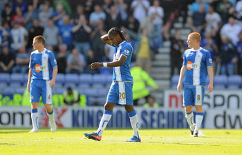 WIGAN, ENGLAND - APRIL 30: Hugo Rodallega of Wigan looks dejected after Everton's first goal during the Barclays Premier League match between Wigan and Everton at the DW Stadium on April 30, 2011 in Wigan, England. (Photo by Michael Regan/Getty Images)