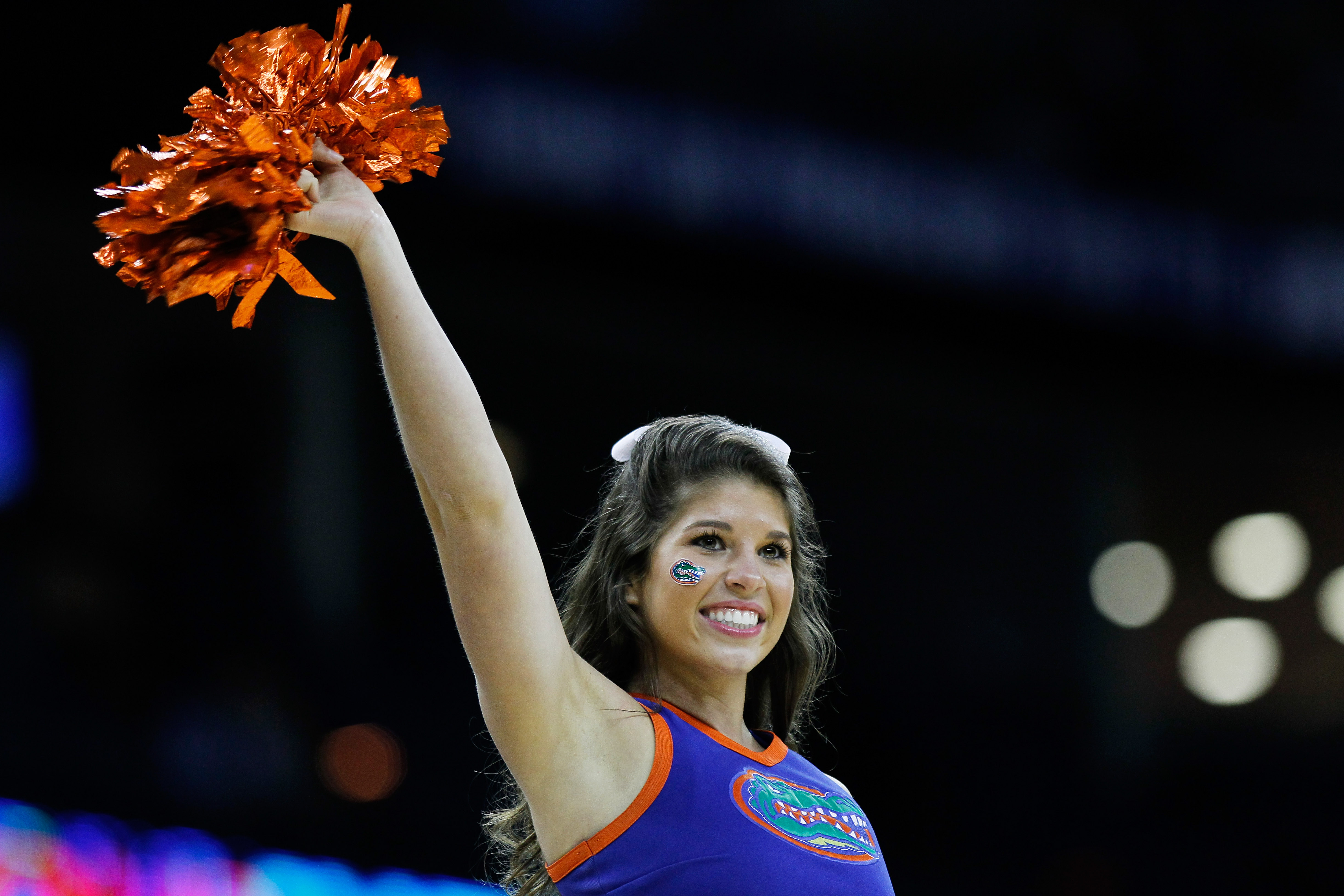 NEW ORLEANS, LA - MARCH 26:  An Florida Gators cheerleader performs during their game against the Butler Bulldogs in the Southeast regional final of the 2011 NCAA men's basketball tournament at New Orleans Arena on March 26, 2011 in New Orleans, Louisiana