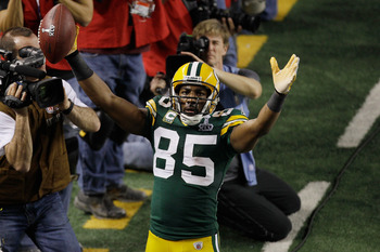 ARLINGTON, TX - FEBRUARY 06:  Greg Jennings #85 of the Green Bay Packers celebrates scoring a fourth quarter touchdown against the Pittsburgh Steelers  during Super Bowl XLV at Cowboys Stadium on February 6, 2011 in Arlington, Texas.  (Photo by Rob Carr/G