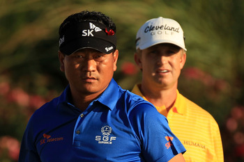 PONTE VEDRA BEACH, FL - MAY 15:  K.J. Choi of South Korea (L) and David Toms (R) look on from the 18th tee box during the final round of THE PLAYERS Championship held at THE PLAYERS Stadium course at TPC Sawgrass on May 15, 2011 in Ponte Vedra Beach, Flor