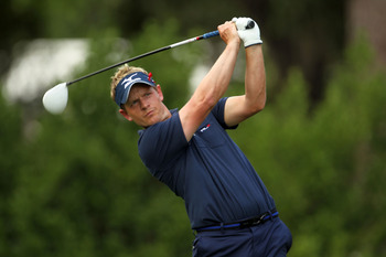 PONTE VEDRA BEACH, FL - MAY 15:  Luke Donald of England hits his tee shot on the 11th hole during the final round of THE PLAYERS Championship held at THE PLAYERS Stadium course at TPC Sawgrass on May 15, 2011 in Ponte Vedra Beach, Florida.  (Photo by Mike