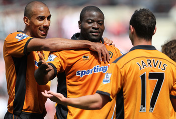 SUNDERLAND, ENGLAND - MAY 14: George Elokobi of Wolverhampton Wanderers (centre) celebrates his goal during the Barclays Premier League match between Sunderland and Wolverhampton Wanderers at The Stadium of Light on May 14, 2011 in Sunderland, England.