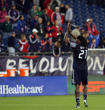 FOXBORO, MA - MAY 14:  Shalrie Joseph #21 of the New England Revolution reacts to the crowd after defeating the Vancouver Whitecaps FC 2-0.  Joseph scored the winning goal at Gillette Stadium May 14, 2011 in Foxboro, Massachusetts. (Photo by Gail Oskin/Ge