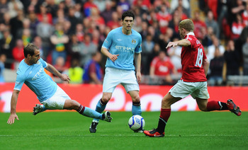LONDON, ENGLAND - APRIL 16:  Pablo Zabaleta of Manchester City tackles Paul Scholes of Man Utd during the FA Cup sponsored by E.ON semi final match between Manchester City and Manchester United at Wembley Stadium on April 16, 2011 in London, England.  (Ph