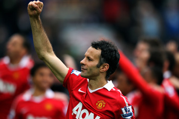 BLACKBURN, ENGLAND - MAY 14:  Ryan Giggs of Manchester United pumps his fist to the fans after drawing the Barclays Premier League match between Blackburn Rovers and Manchester United but winning the title at Ewood park on May 14, 2011 in Blackburn, Engla