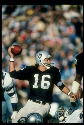 Oakland Raiders quarterback Jim Plunkett (16) prepares to throw