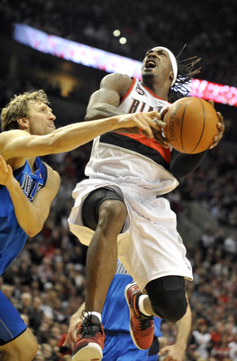 PORTLAND, OR - APRIL 28: Gerald Wallace #3 of the Portland Trail Blazers is fouled by Dirk Nowitski #41 of the Dallas Mavericks during the fourth quarter of Game Six of the Western Conference Quartefinals in the 2011 NBA Playsoffs on April 28, 2011 at the