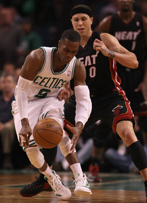 BOSTON, MA - MAY 09:  Rajon Rondo #9 of the Boston Celtics tries to keep the ball from Mike Bibby #0 of the Miami Heat in Game Four of the Eastern Conference Semifinals in the 2011 NBA Playoffs on May 9, 2011 at the TD Garden in Boston, Massachusetts.  Th