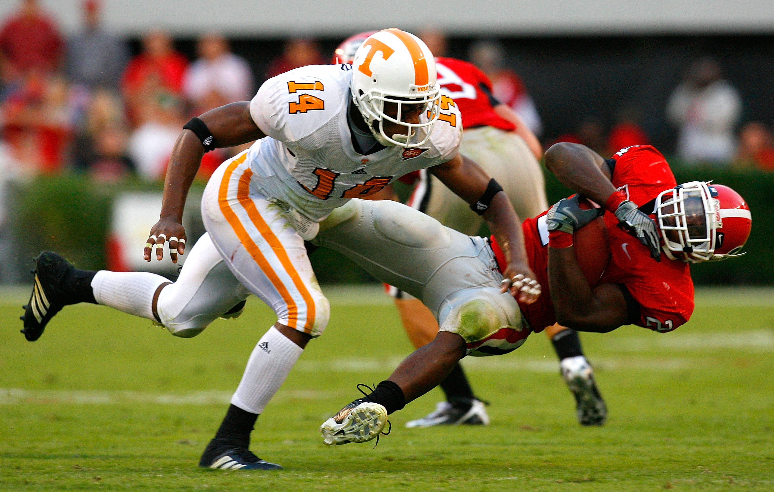 ATHENS, GA - OCTOBER 11: Eric Berry #14 of the Tennessee Volunteers tackles Knowshon Moreno #24 of the Georgia Bulldogs during the game at Sanford Stadium on October 11, 2008 in Athens, Georgia. (Photo by Kevin C. Cox/Getty Images)