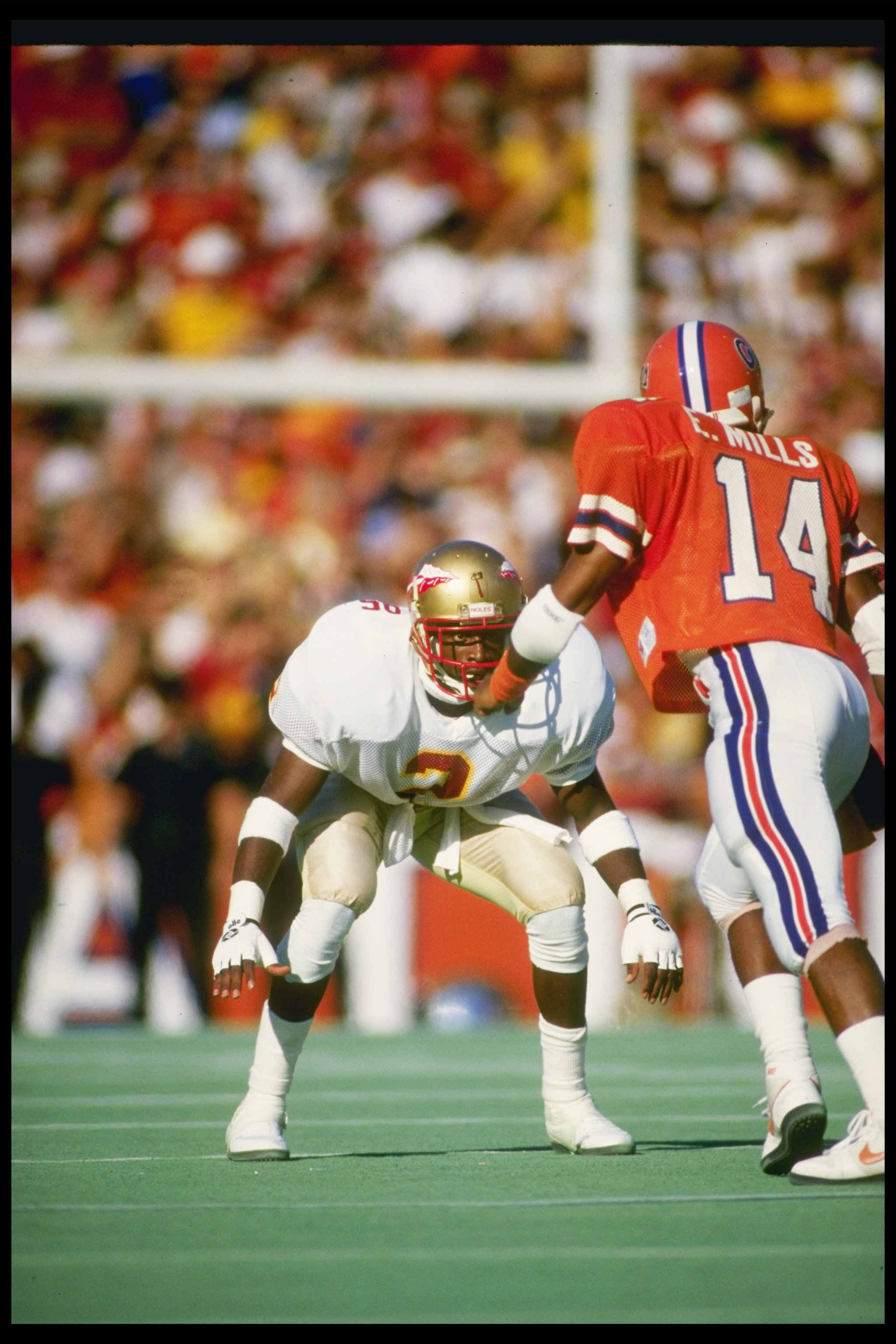 28 Nov 1987: Cornerback Deion Sanders of the Florida State Seminoles covers wide receiver Ernie Mills of the Florida Gators at Florida Field in Gainesville, Florida. Florida State won the game 28-14. Mandatory Credit: Allen Dean Steele /Allsport
