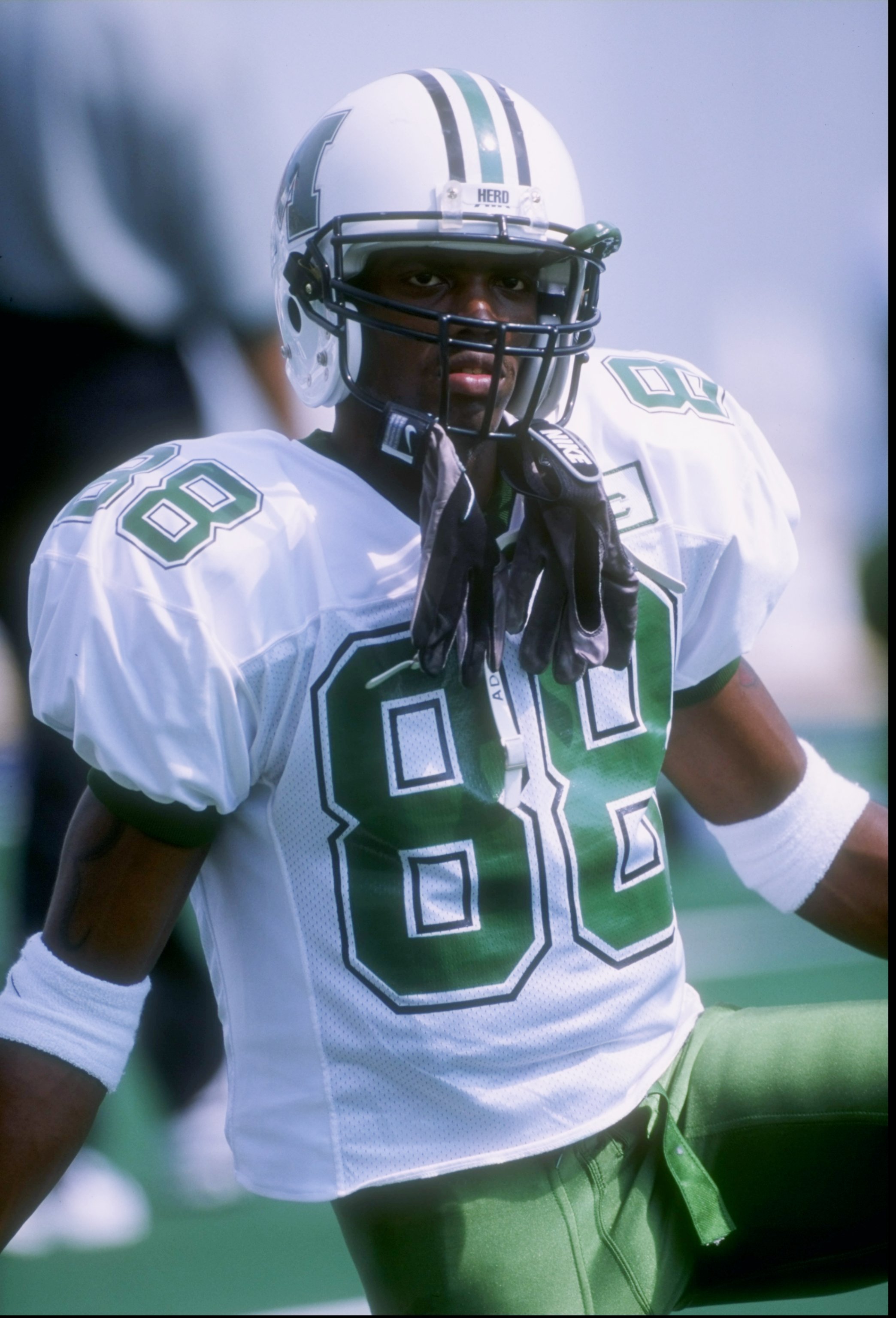 30 Aug 1997: Wide receiver Randy Moss of the Marshall Thundering Herd stands on the field during a game against the West Virginia Mountaineers at Mountaineer Field in Morgantown, West Virginia. West Virginia won the game 42-31. Mandatory Credit: Rick St
