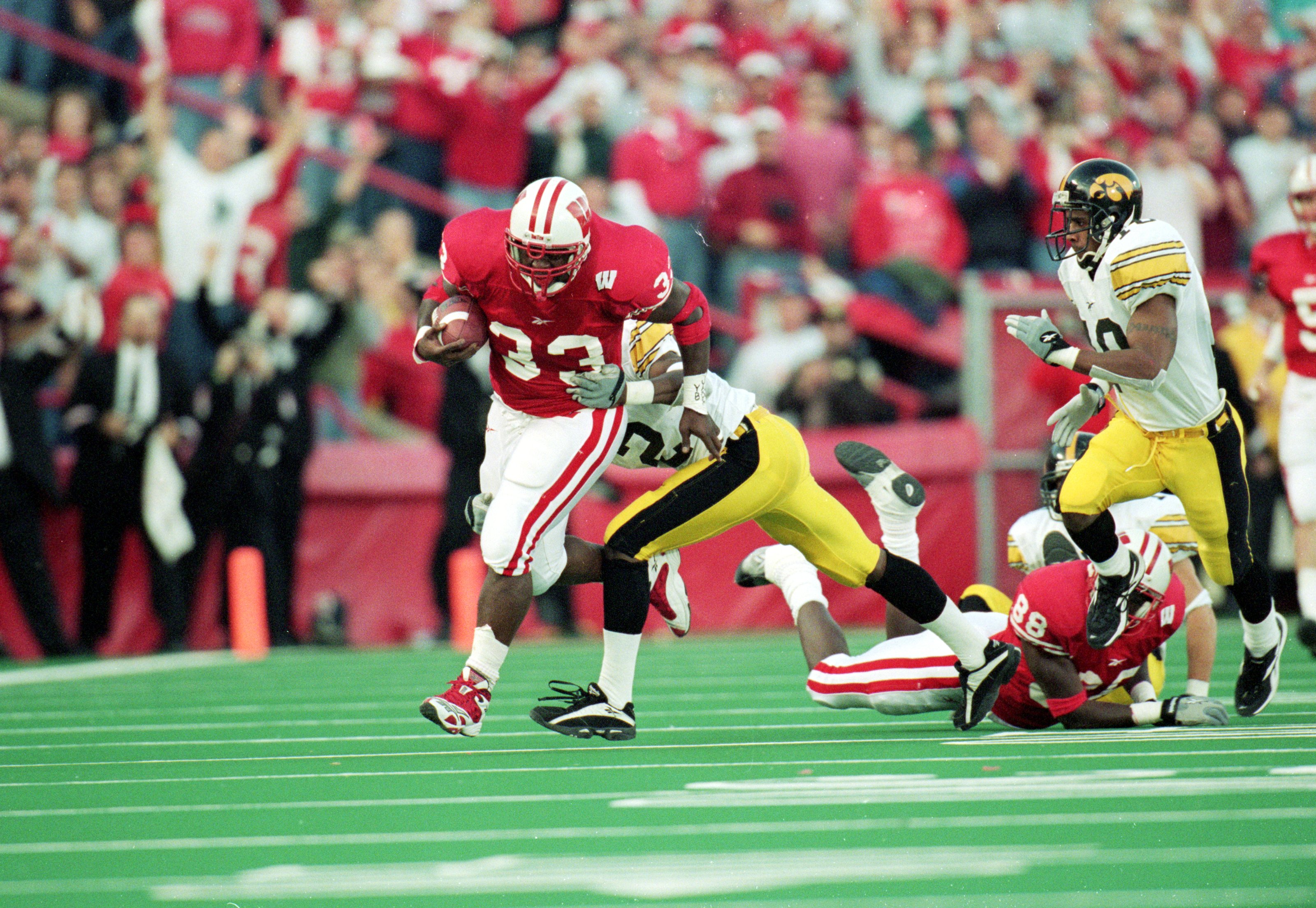 13 Nov 1999: Ron Dayne #33 of the Wisconsin Badgers carries the ball for a 32yard gain for a NCAA record during the game against the Iowa Hawkeyes at the Camp Randall Stadium in Madison, Wisconsin. The Badgers defeated the Hawkeyes 41-3. Mandatory Credit