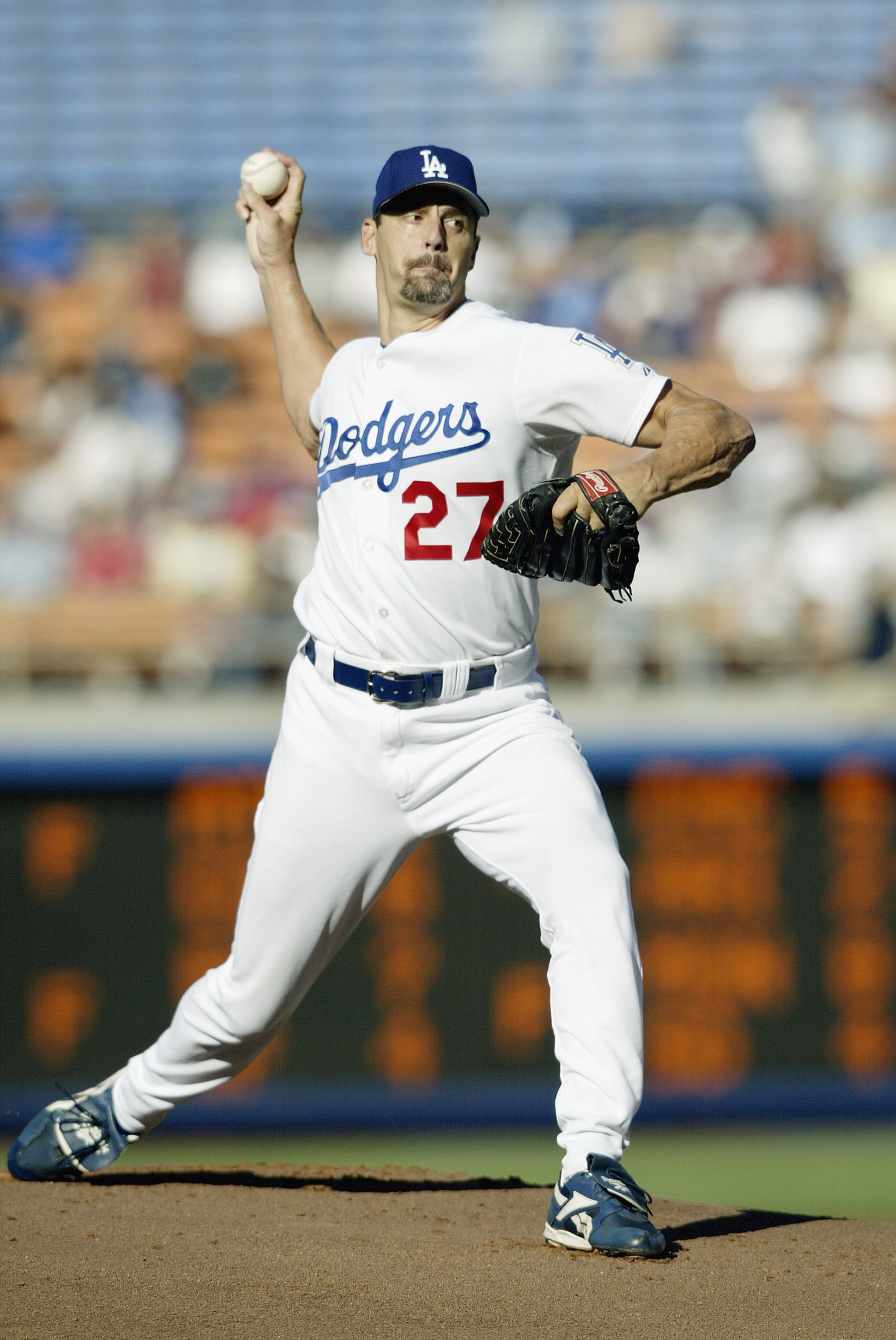 LOS ANGELES - AUGUST 24:  Starting pitcher Kevin Brown #27 of the Los Angeles Dodgers delivers a pitch during the National League game against the New York Mets at Dodgers Stadium on August 24, 2003 in Los Angeles, California. The Mets defeated the Dodger