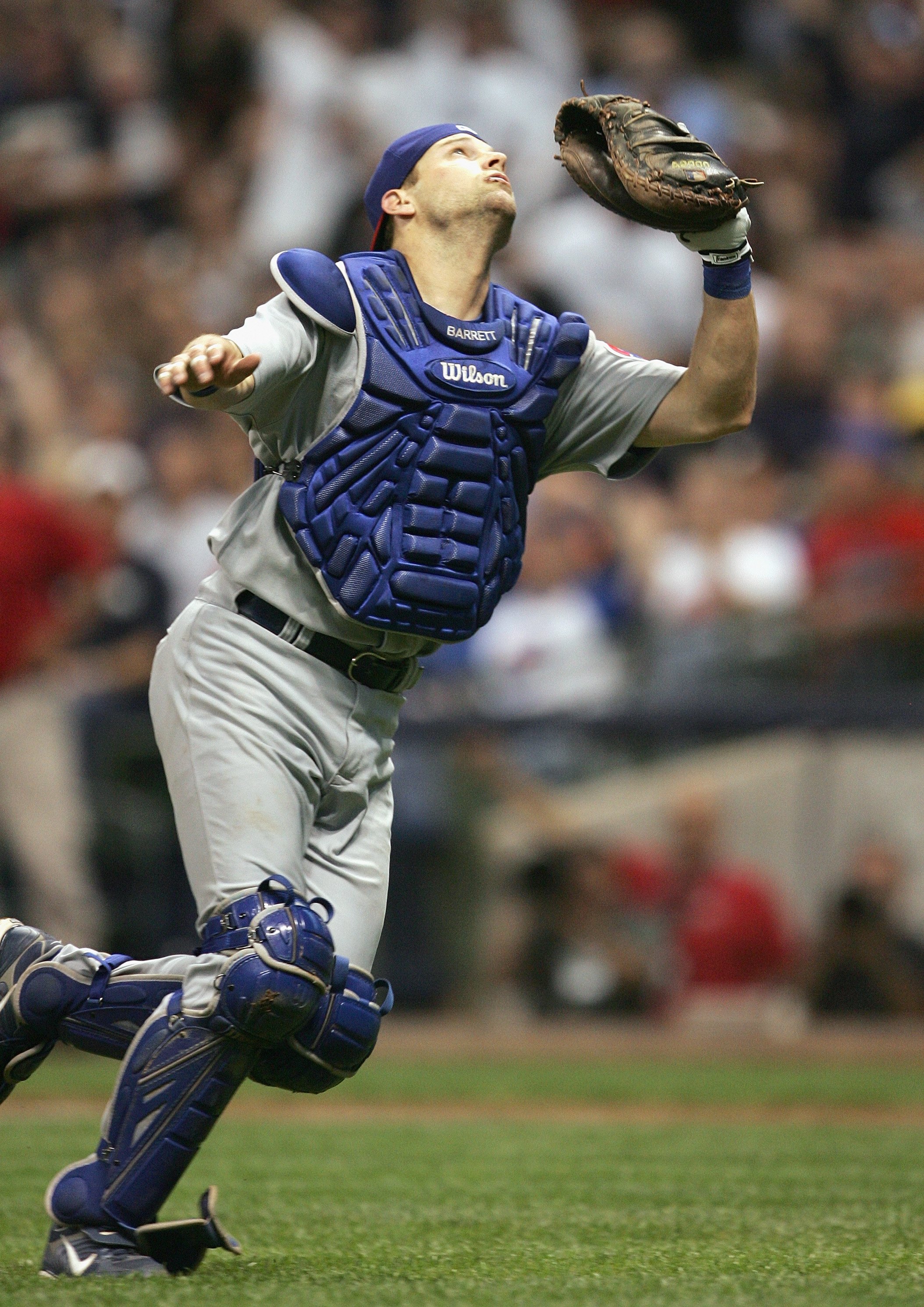 MILWAUKEE - JUNE 4: Catcher Michael Barrett #8 of the Chicago Cubs runs to make the catch against the Milwaukee Brewers at Miller Park on June 4, 2007 in Milwaukee, Wisconsin. (Photo by Jonathan Daniel/Getty Images)