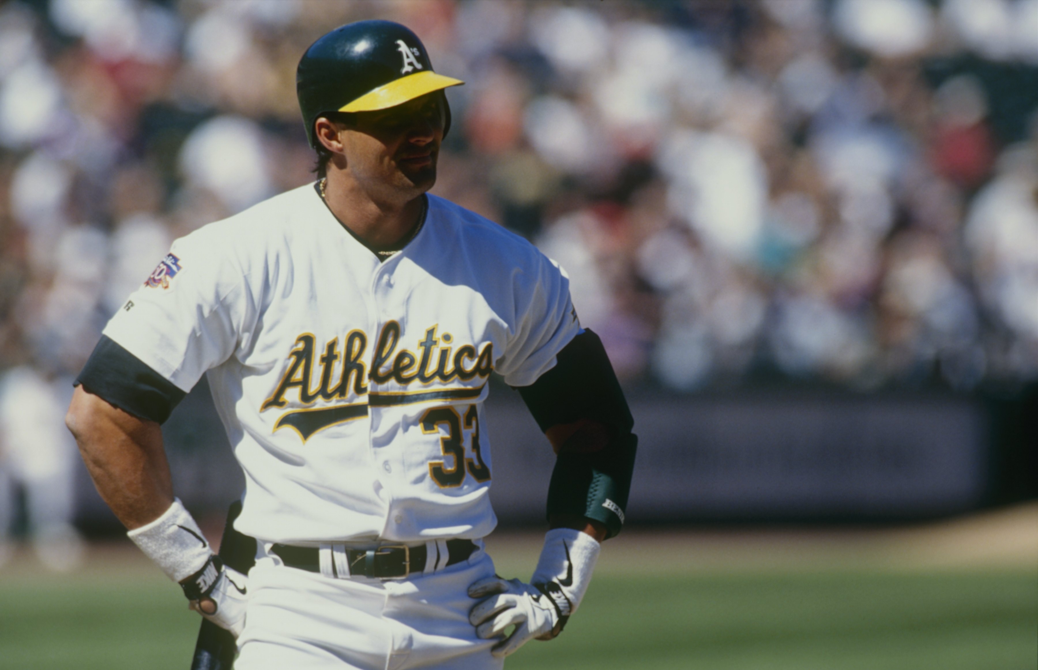 OAKLAND, CA - APRIL 3:  Jose Canseco of the Oakland Athletics looks on during the game against the Cleveland Indians at Oakland-Alameda County Coliseum on April 3, 1997 in Oakland, California. (Photo by Otto Greule Jr/Getty Images)