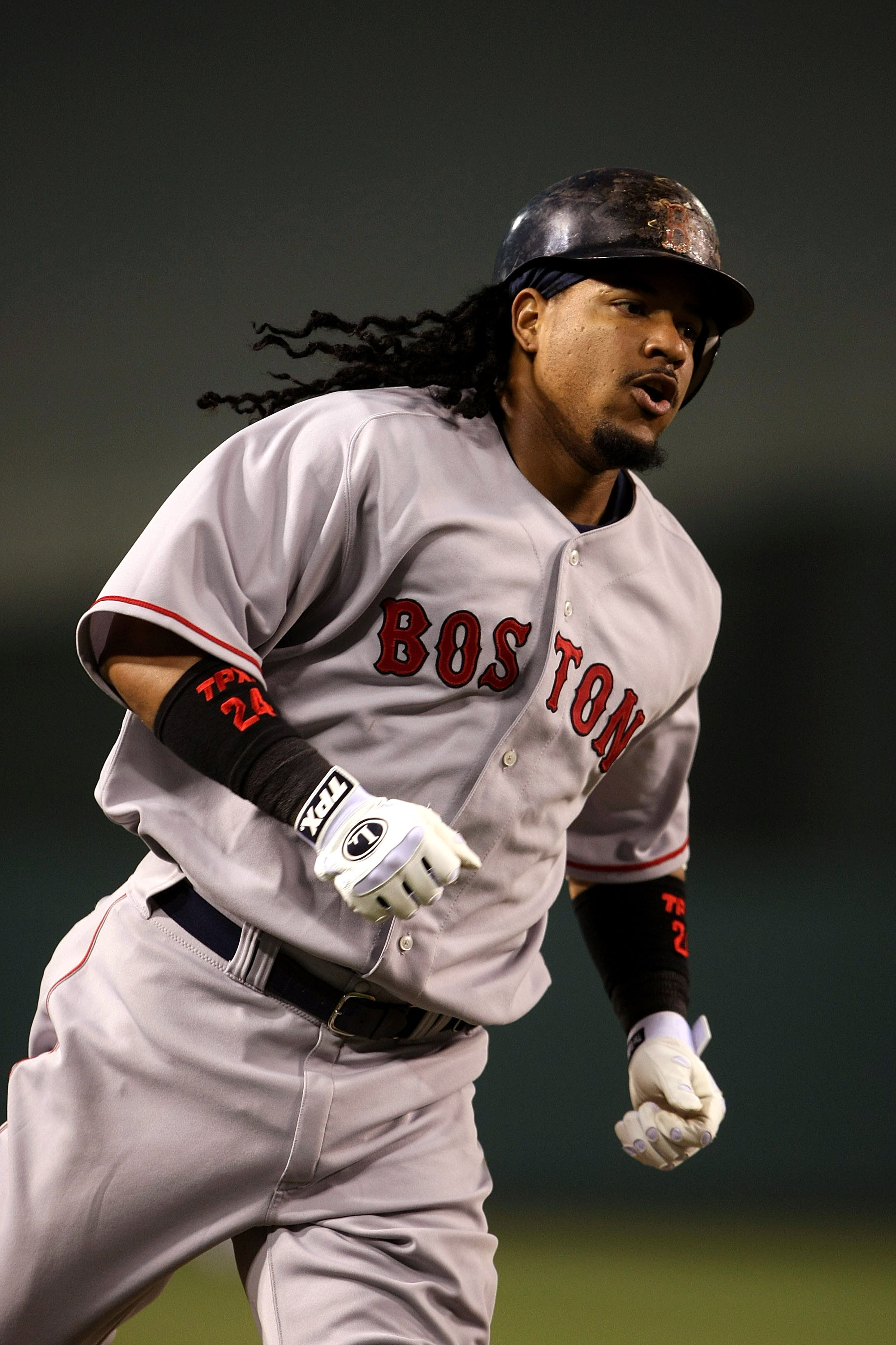 ANAHEIM, CA - JULY 18:  Manny Ramirez #24 of the Boston Red Sox runs the bases after hitting a home run in the fourth inning against the Los Angeles Angels of Anaheim on July 18, 2008 at Angel Stadium in Anaheim, California.  (Photo by Stephen Dunn/Getty
