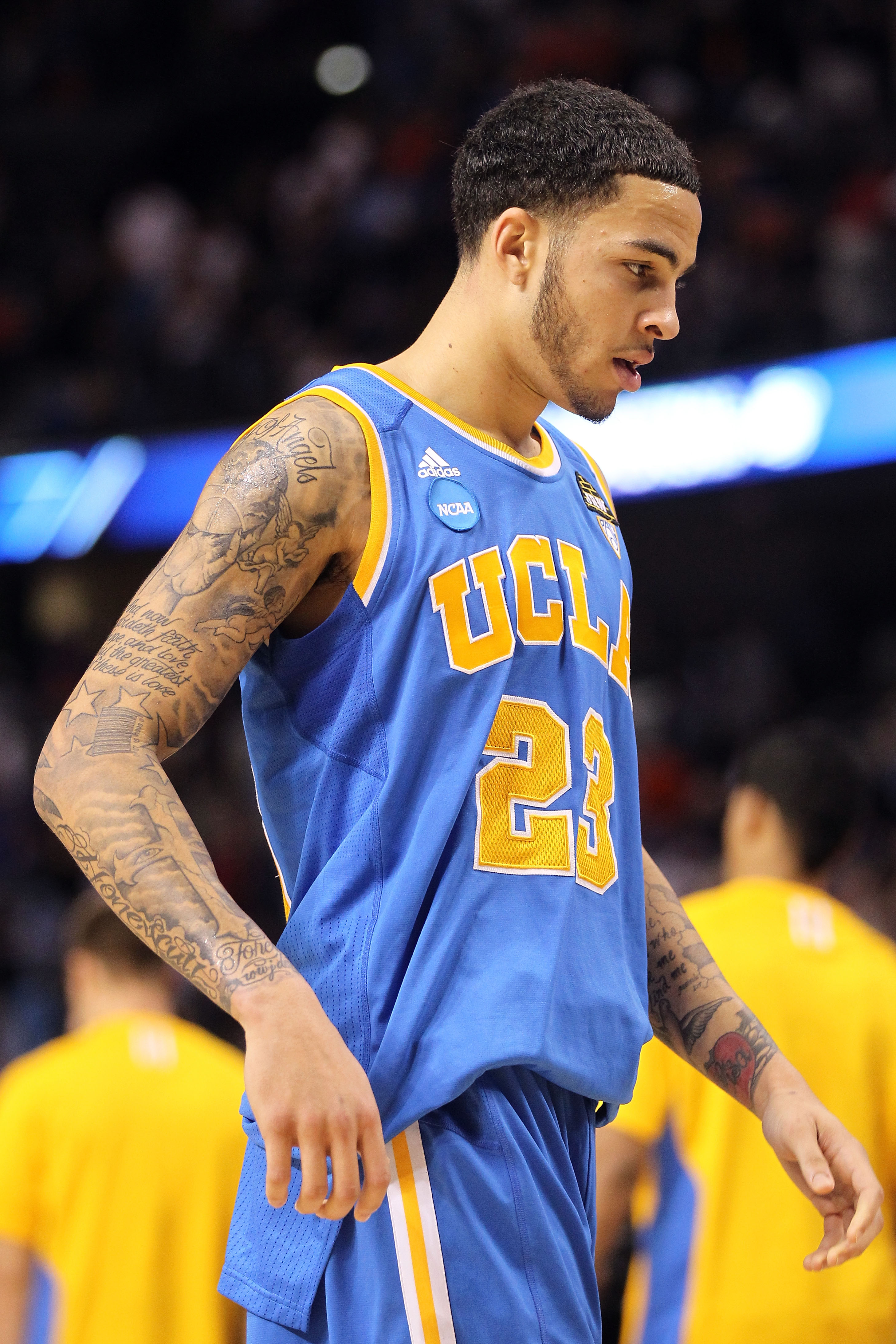 TAMPA, FL - MARCH 19:  Tyler Honeycutt #23 of the UCLA Bruins walks off the court dejected after they lost 73-65 against the Florida Gators during the third round of the 2011 NCAA men's basketball tournament at St. Pete Times Forum on March 19, 2011 in Ta
