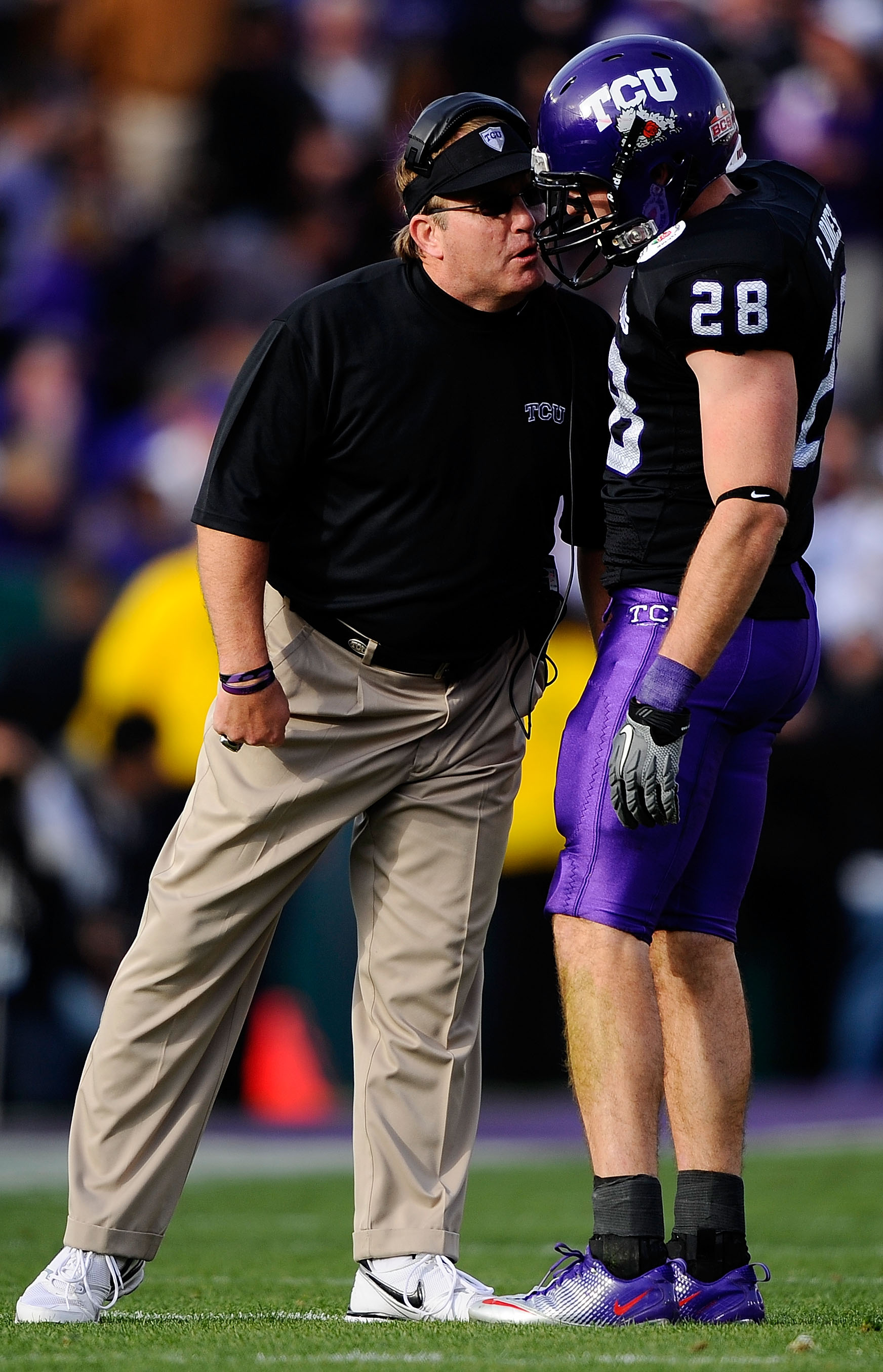 PASADENA, CA - JANUARY 01:  Head coach Gary Patterson of the TCU Horned Frogs talks with safety Colin Jones #28 on the field during their game against the Wisconsin Badgers in the 97th Rose Bowl game on January 1, 2011 in Pasadena, California.  (Photo by