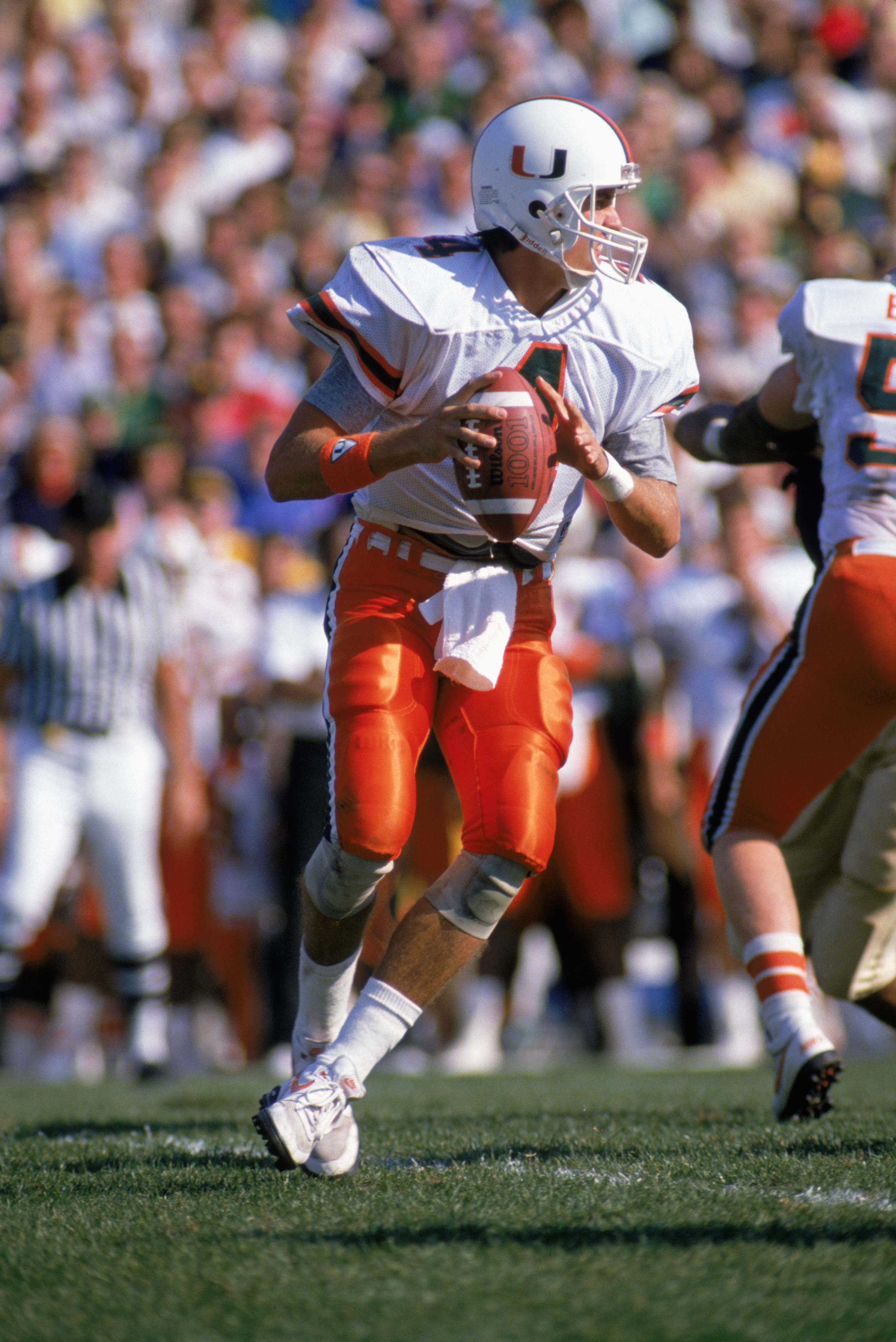 MIAMI - OCTOBER 15: Quarterback Steve Walsh #4 of the University of Miami Hurricanes moves to pass during a game against Notre Dame Fighting Irish on October 15, 1988 in Miami, Florida. Notre Dames won 31-30. (Photo by: Jonathan Daniel/Getty Images)