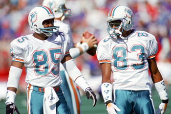 ORCHARD PARK, NY - OCTOBER 4:  Wide receiver Mark Duper #85 and Mark Clayton #83 of the Miami Dolphins talk during a game against the Buffalo Bills at Ralph Wilson Stadium on October 4, 1992 in Orchard Park, New York.  The Dolphins won 37-10.  (Photo by R