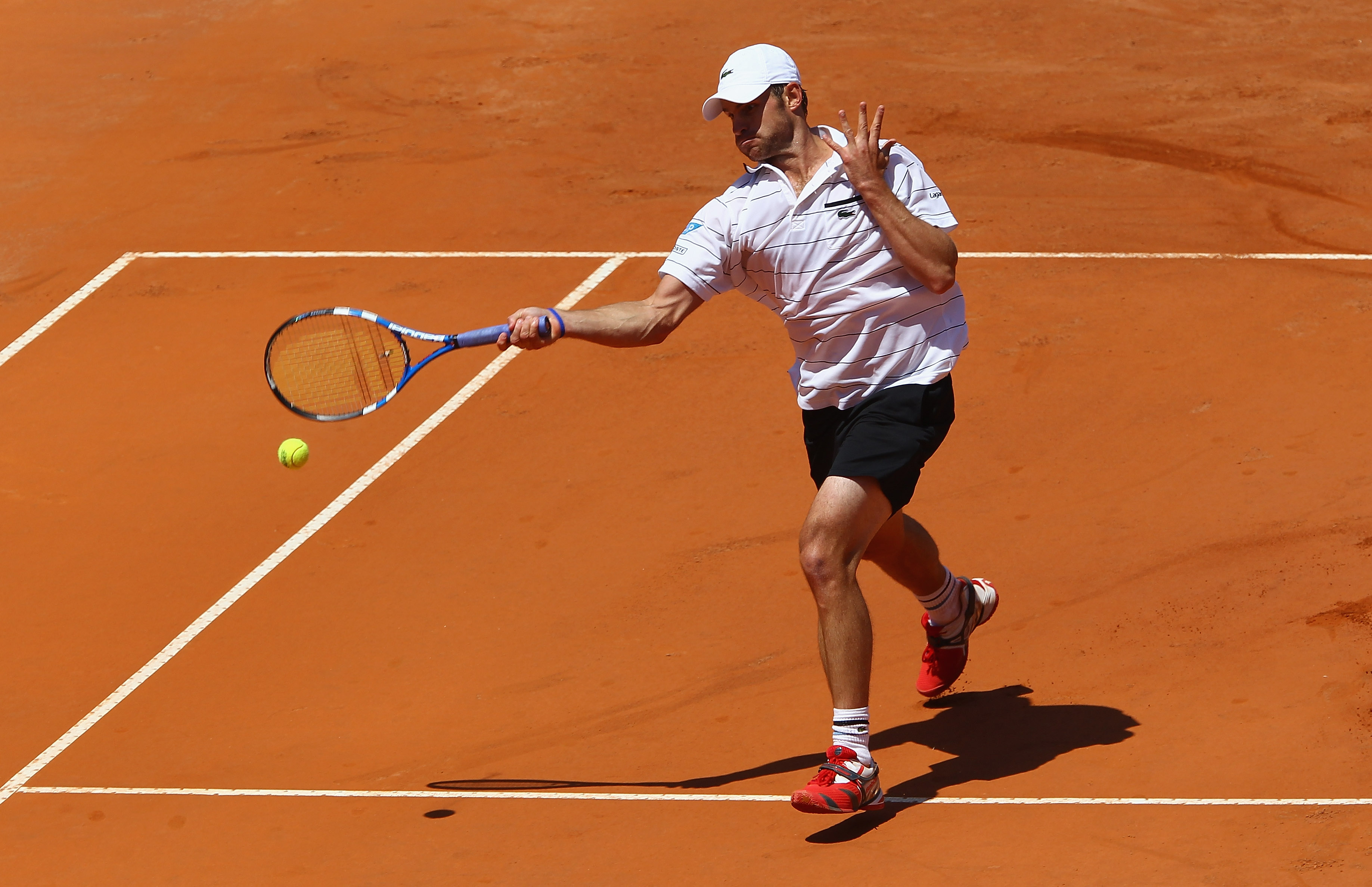 ROME, ITALY - MAY 09:  Andy Roddick of the USA plays a forehand during his first round match against Gilles Simon of France during day two of the Internazoinali BNL D'Italia at the Foro Italico Tennis Centre on May 9, 2011 in Rome, Italy.  (Photo by Clive