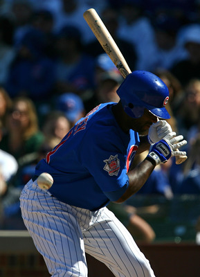 CHICAGO - AUGUST 30: Milton Bradley #21 of the Chicago Cubs is hit by a pitch from Nelson Figueroa of the New York Mets in the 5th inning on August 30, 2009 at Wrigley Field in Chicago, Illinois. (Photo by Jonathan Daniel/Getty Images)