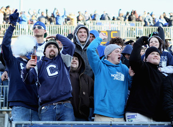 EAST HARTFORD, CT - NOVEMBER 27:  Fans cheer on the Connecticut Huskies as they face the Cincinnati Bearcats on November 27, 2010 at Rentschler Field in East Hartford, Connecticut. The Huskies defeated the Bearcats 38-17.  (Photo by Elsa/Getty Images)