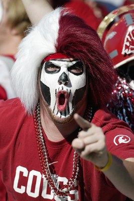 PULLMAN, WA - OCTOBER 21:  A Washington State Cougars fan cheers during the game against the Oregon Ducks on October 21, 2006 at Martin Stadium in Pullman, Washington. Washington State won 34-23. (Photo by Otto Greule Jr/Getty Images)
